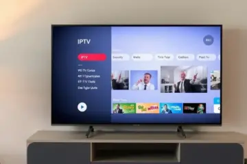 alt_text: A cozy living room with a TV displaying the Plex Media Server interface, showing an IPTV channel guide and playing a video.